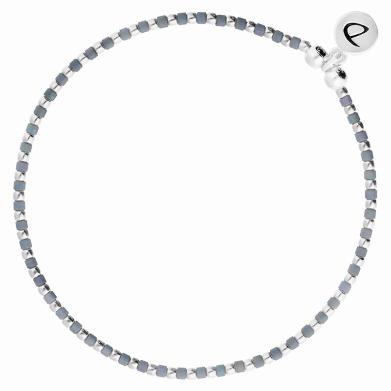 Bracelet élastique GRAIN DE FOLIE en argent - Perles argent & bleues signé DORIANE Bijoux Bracelet élastique GRAIN DE FOLIE en argent - Perles argent & bleues signé DORIANE Bijoux